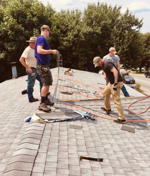 Man repairing a roof.