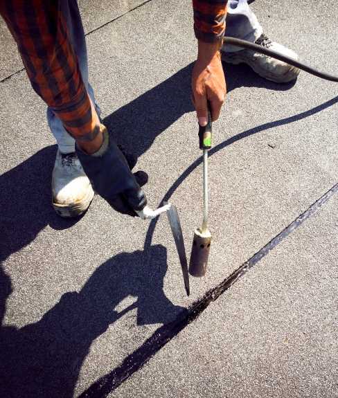 Man repairing a roof.